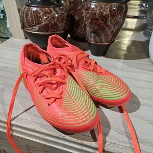 Vibrant Orange and Green Soccer Cleats